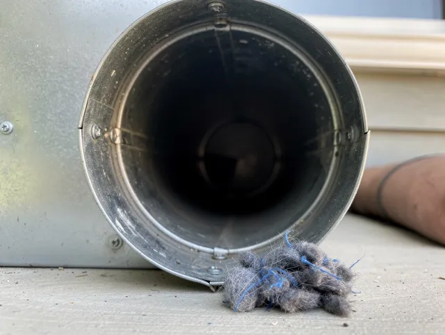 The Hammocks Dryer Vent Cleaning technician using specialized equipment to clear severe dryer vent blockage in The Hammocks